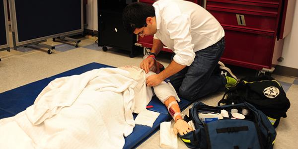 emt working over patient on the floor